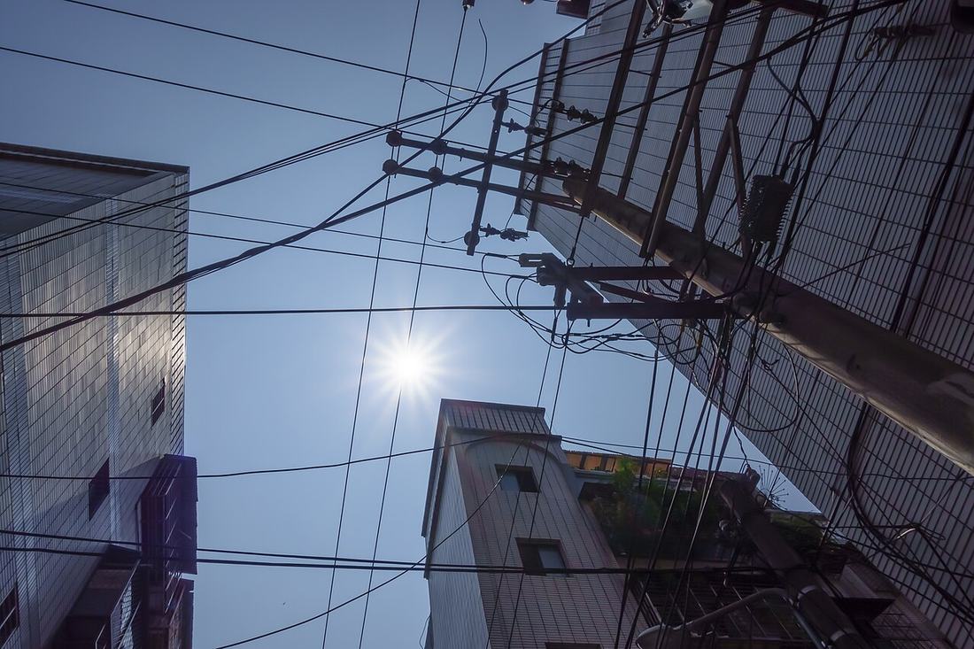 Apartment buildings beside a utility pole