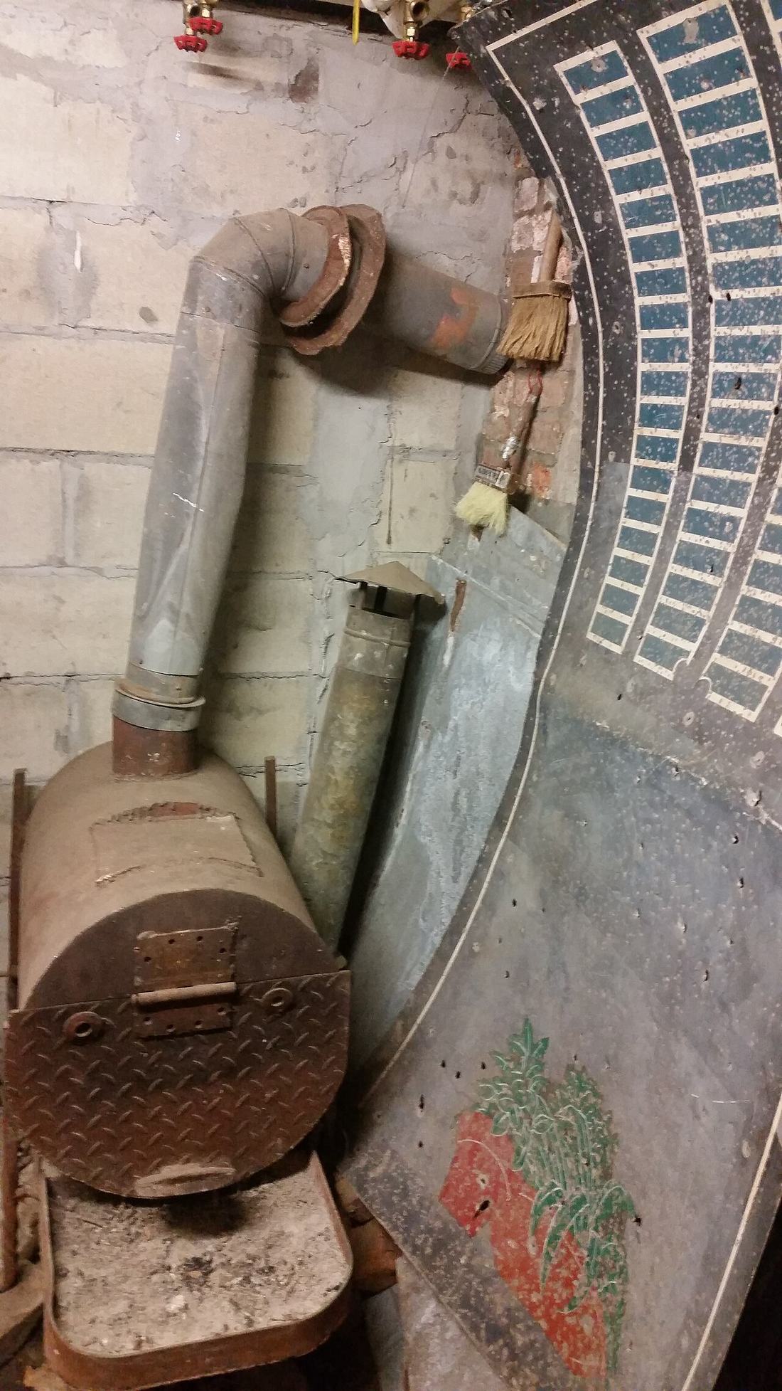 A wood-burning furnace in a basement