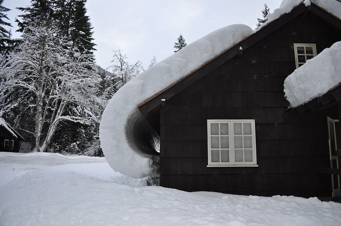 Snow coming off a house roof