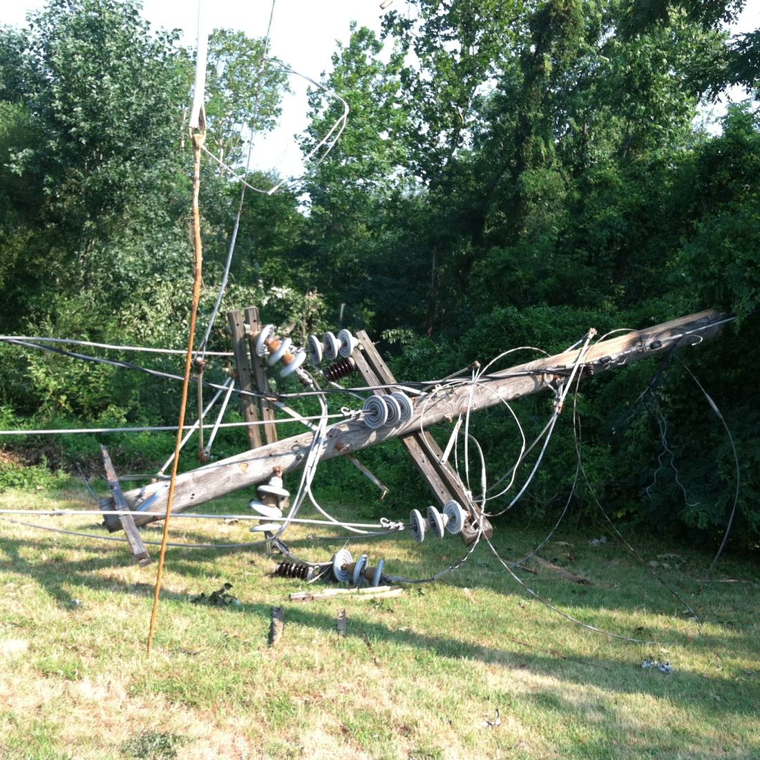 A downed power line pole after a storm