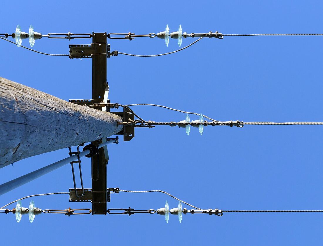 The top of a power line pole